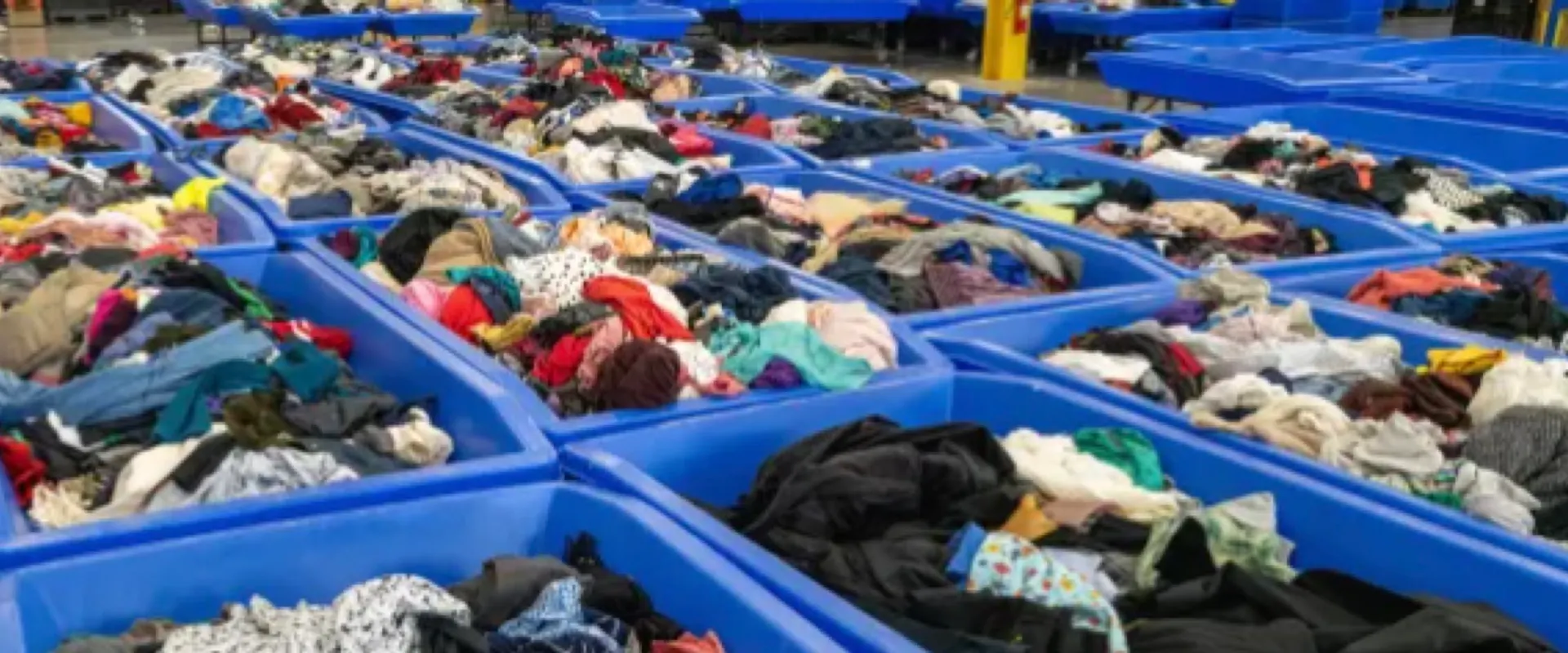 Rolling bins of donated goods at a Goodwill outlet store